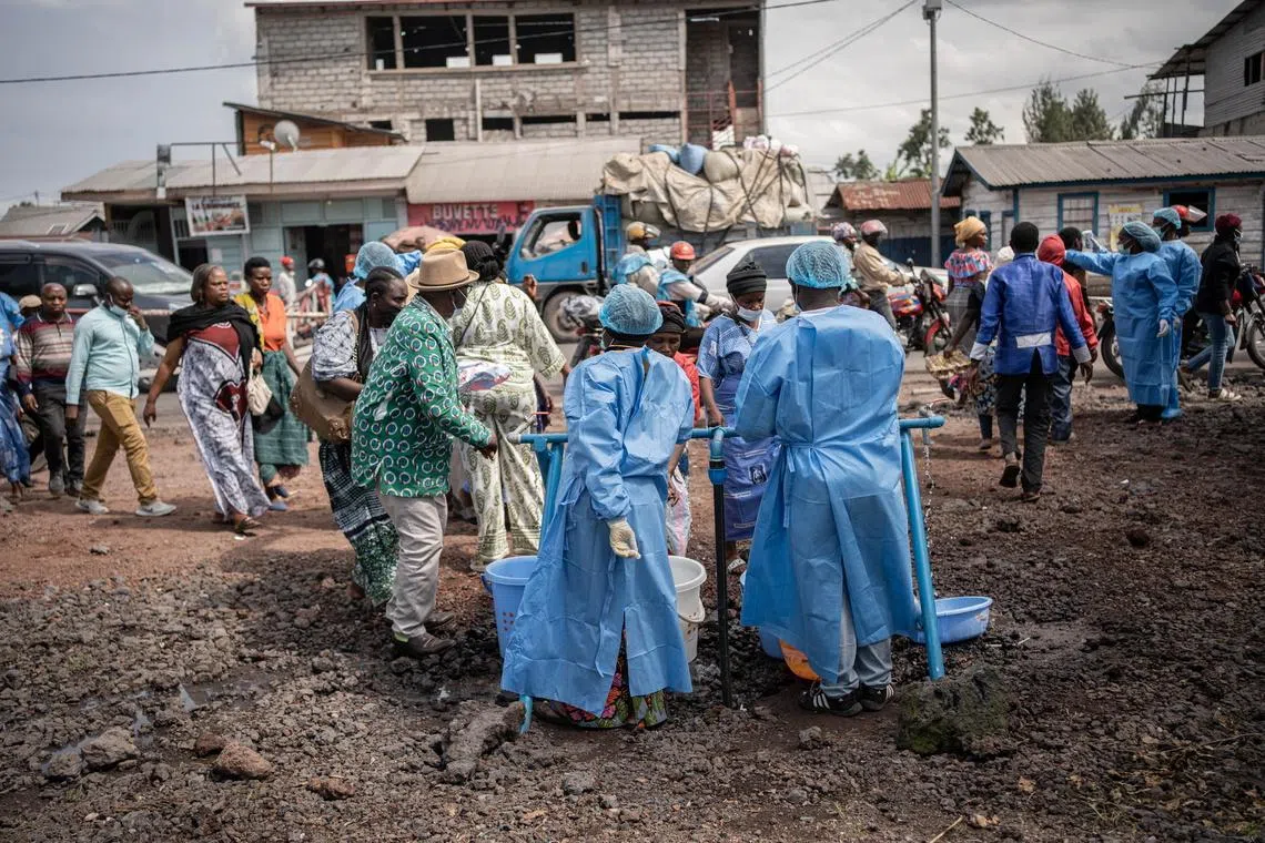 Health workers in protective gowns and masks operating at a checkpoint set up for preventive measures against Ebola in Kanyaruchinya, near Goma, North Kivu, Democratic Republic of Congo, on May 27, 2026.