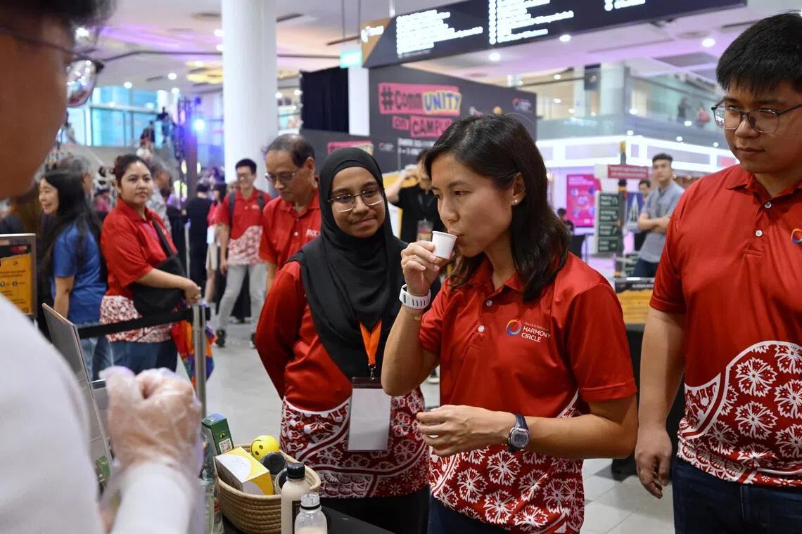 Senior Parliamentary Secretary for Culture, Community and Youth Goh Hanyan trying talbina at the festival on Sept 18.