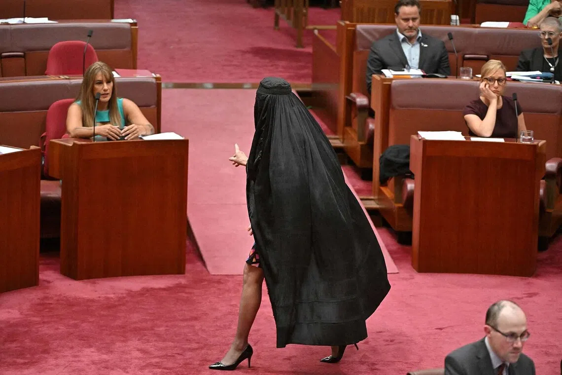 One Nation leader Pauline Hanson wearing a burqa in the Senate chamber at Parliament House in Canberra, Australia, Nov 24, 2025. 
