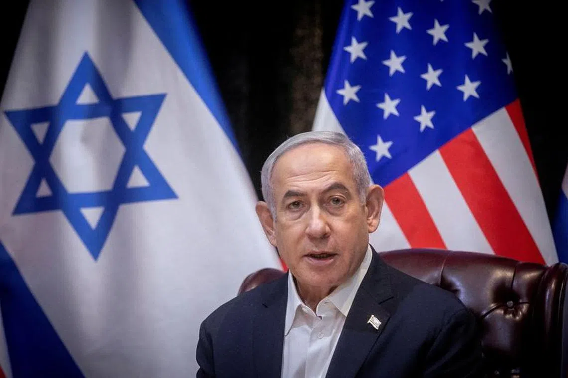 Israeli Prime Minister Benjamin Netanyahu speaks during a meeting with U.S. President Joe Biden to discuss the ongoing conflict between Israel and Hamas, in Tel Aviv, Israel, Wednesday, Oct. 18, 2023. Miriam Alster/Pool via REUTERS/File photo
