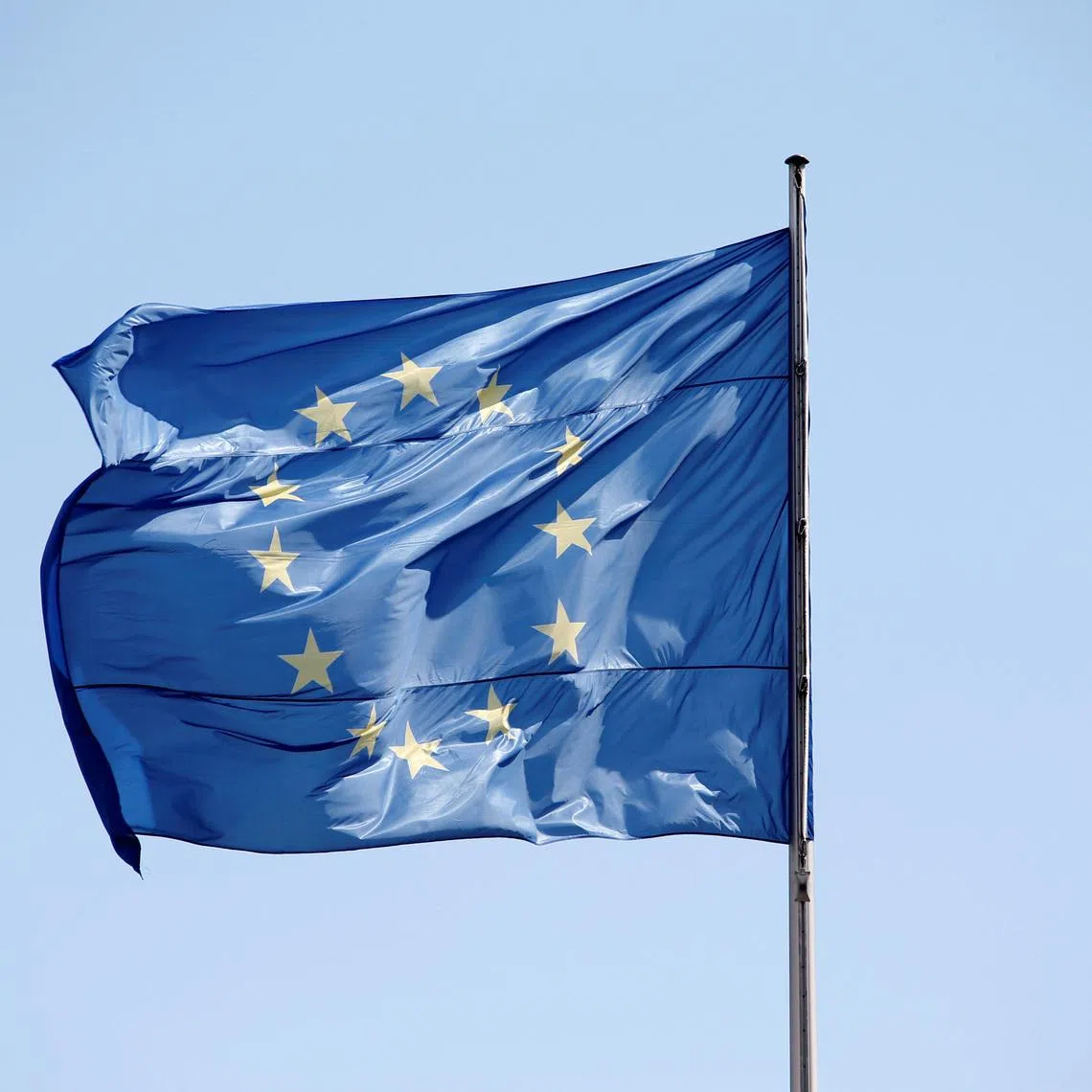 FILE PHOTO: The European Union (EU) flag is seen on a sunny day and blue sky at the Chancellery in Berlin, Germany, April 29, 2016.    REUTERS/Fabrizio Bensch/File Photo