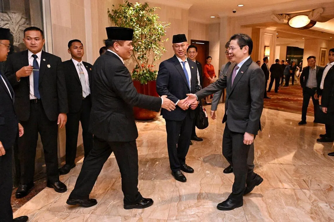 Prime Minister Lawrence Wong (right) meeting Hotmangaradja Pandjaitan, Indonesia’s Ambassador to Singapore, at the Shangri-La Jakarta on July 5, ahead of the Singapore-Indonesia Leaders’ Retreat in the Indonesian capital.