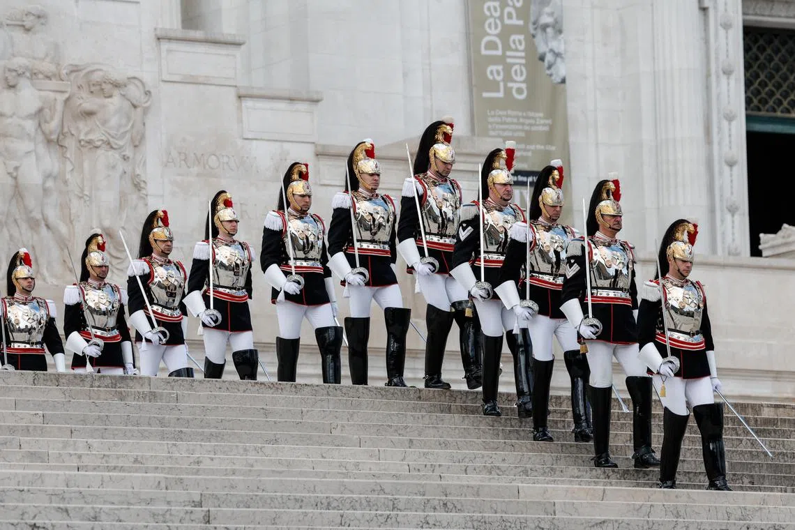 The Corazzieri, Presidential Guard, lining up during a wreath-laying ceremony at the Altar of the Fatherland to commemorate the 79th Liberation Day, in Rome, Italy, on April 25, 2024. 