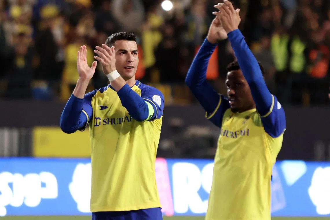 Al Nassr's Cristiano Ronaldo applauds fans after the match.