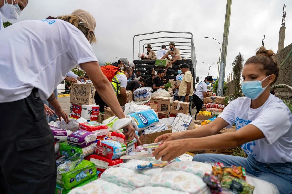 Volunteers distribute food and essential items in Caraballeda, La Guaira state, Venezuela.