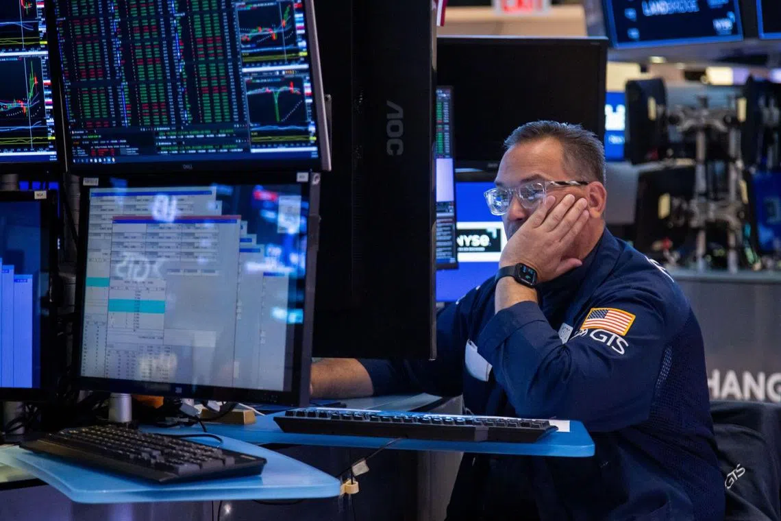 A trader works on the floor of the New York Stock Exchange, in New York city.