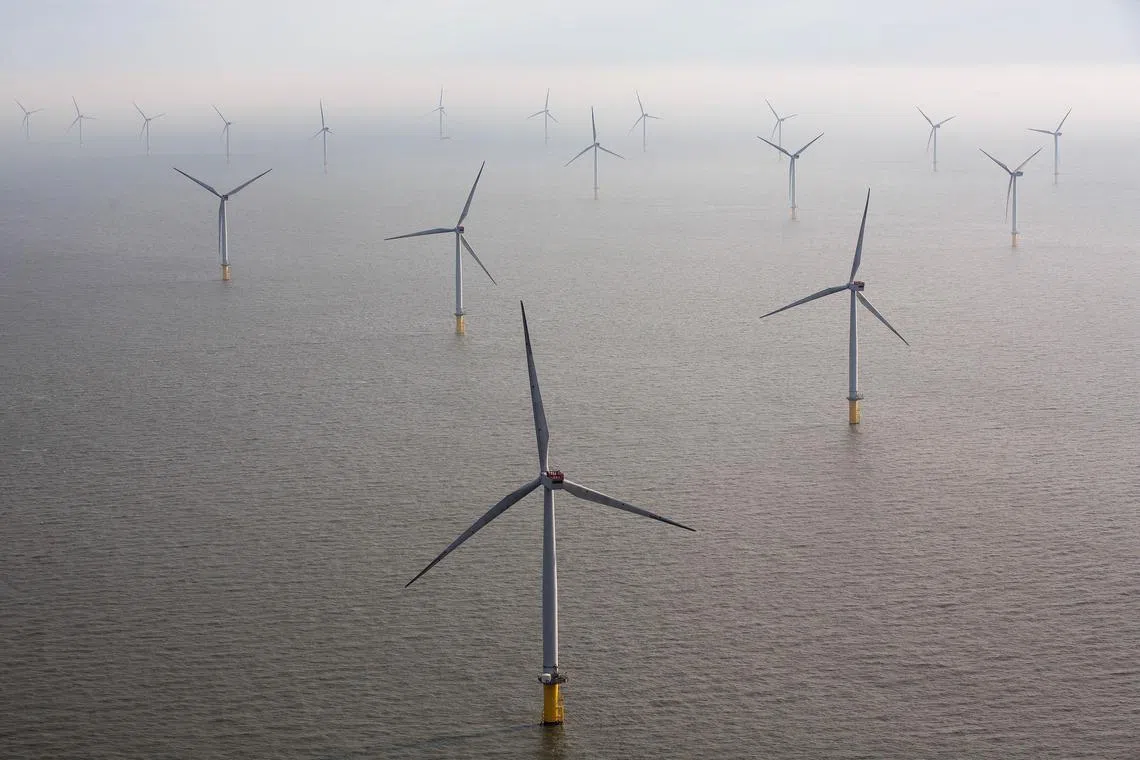Wind turbines sit in the North Sea at the London Array offshore wind farm, a partnership between Dong Energy A/S, E.ON AG and Abu Dhabi-based Masdar, in the Thames Estuary, U.K., on Tuesday, Oct. 27, 2015. The London Array, east of London, has 175 Siemens turbines and a capacity of 630MW. Photographer: Simon Dawson/Bloomberg