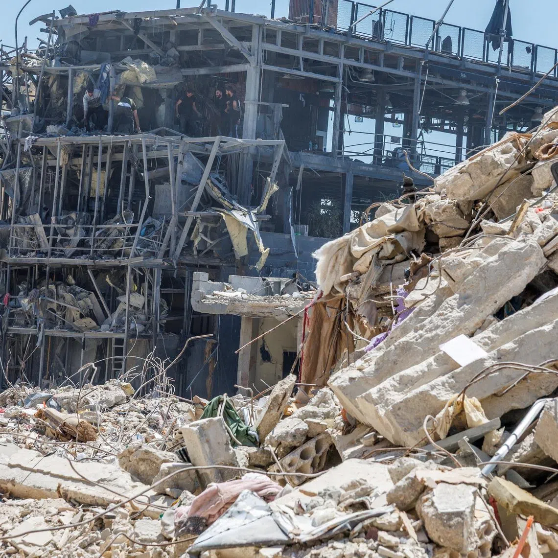 Workers clean a restaurant that was damaged by an Israeli strike, amid a temporary ceasefire between Lebanon and Israel, in Tyre, Lebanon, on April 23.