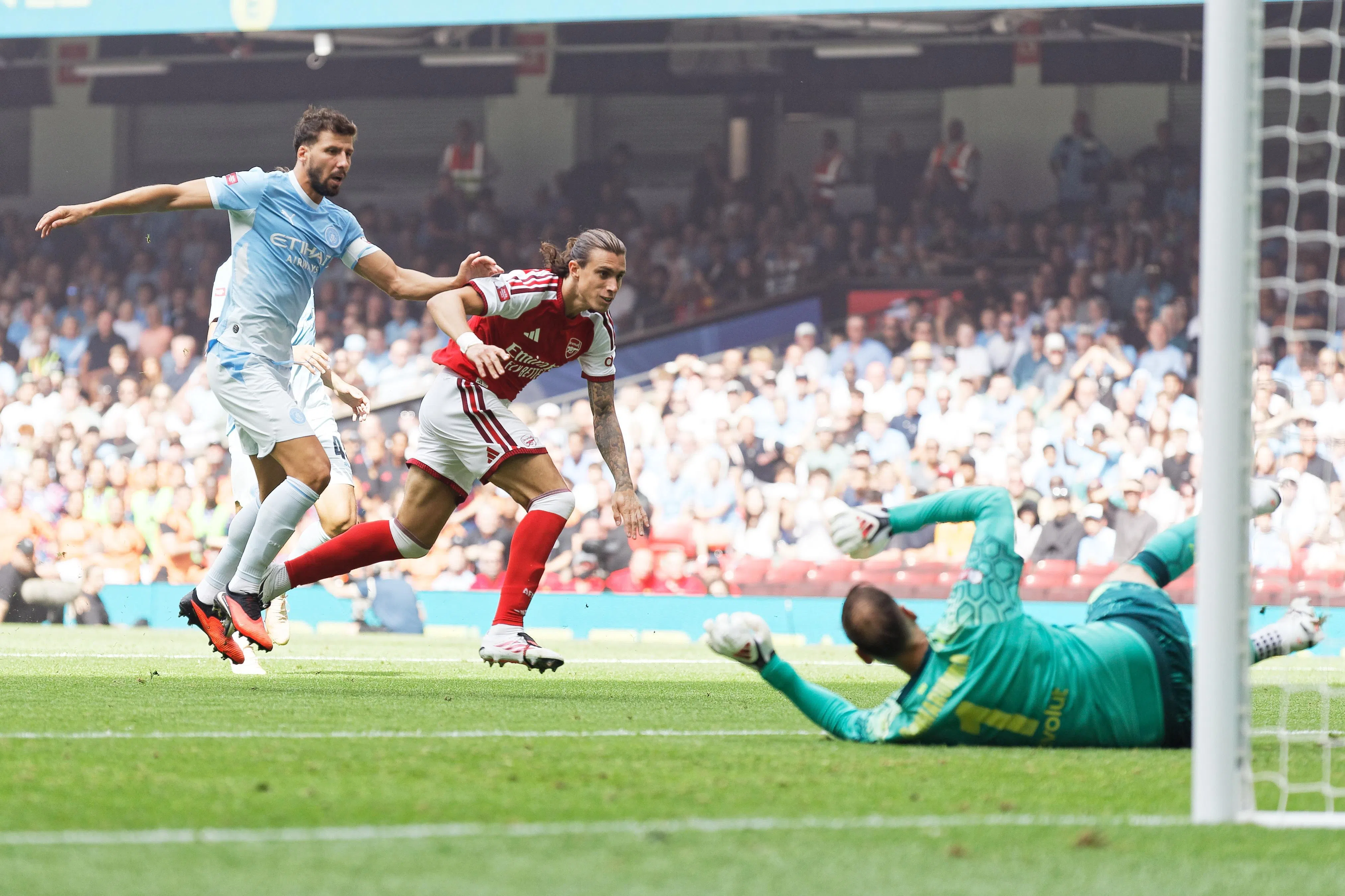 Arsenal’s Riccardo Calafiori scores his team’s first goal after 24 seconds.