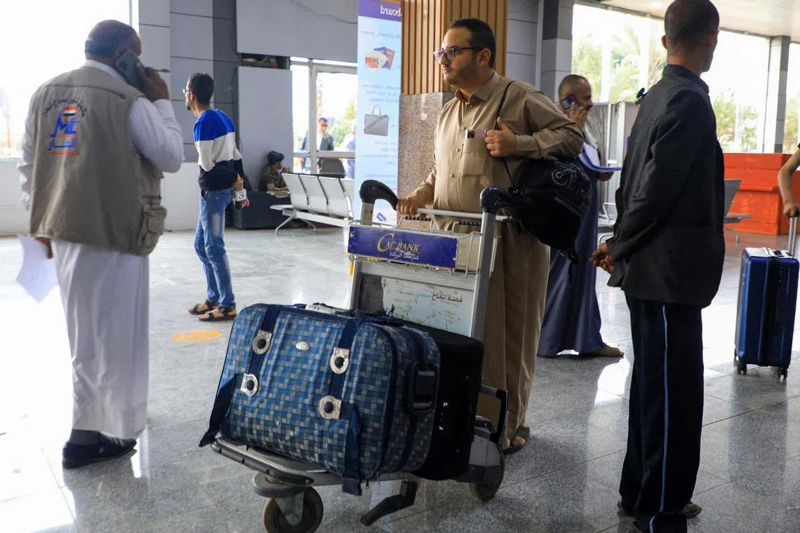 Yemeni Muslims wait at Sanaa International Airport to board the flight heading to Saudi Arabia.