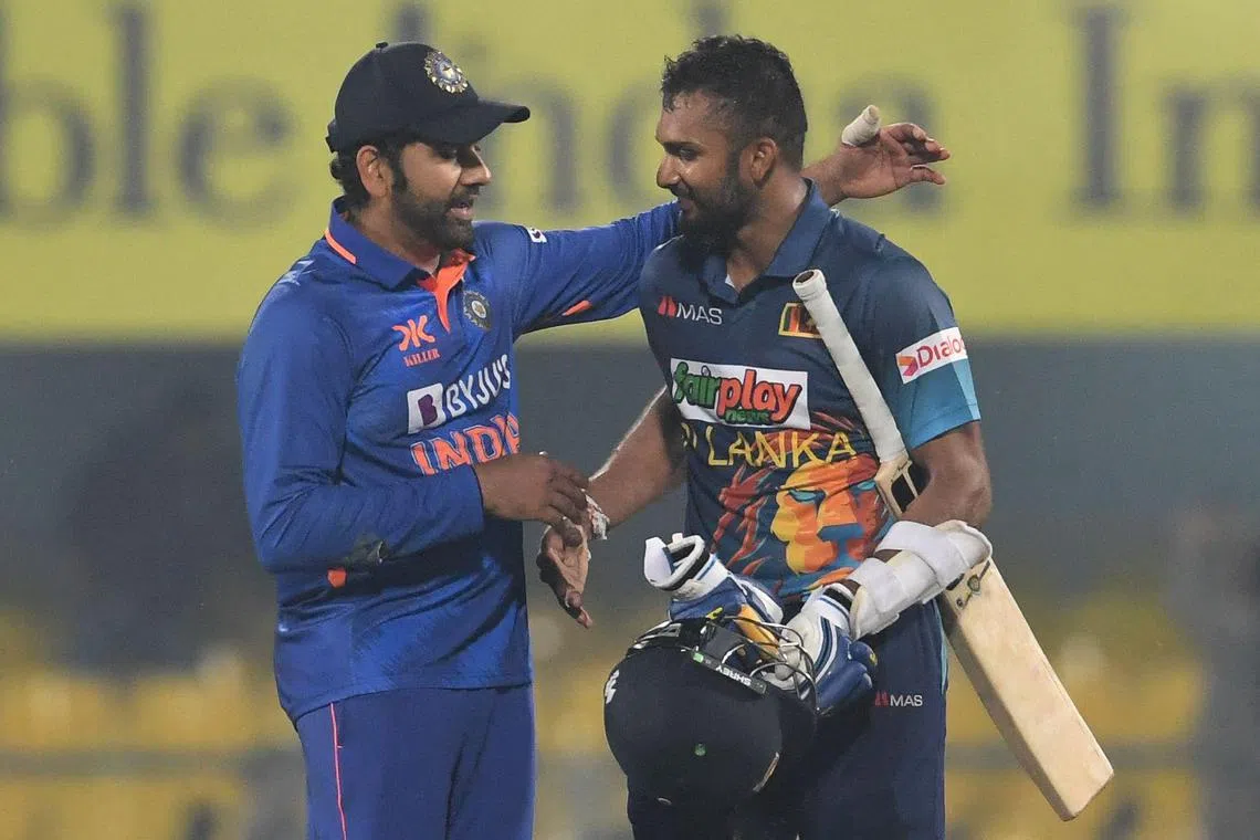 India's captain Rohit Sharma (left) congratulating his Sri Lankan counterpart Dasun Shanaka for his century at the end of the first one-day international cricket match between India and Sri Lanka on Tuesday. 