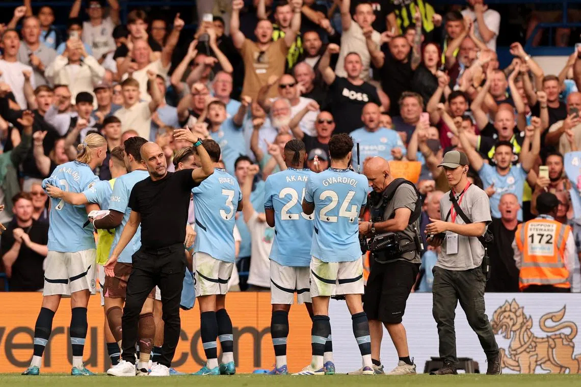Soccer Football - Premier League - Chelsea v Manchester City - Stamford Bridge, London, Britain - August 18, 2024 Manchester City manager Pep Guardiola celebrates after the match REUTERS/David Klein