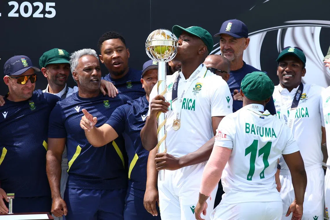 FILE PHOTO: Cricket - 2025 ICC World Test Championship Final - South Africa v Australia - Lord's Cricket Ground, London, Britain - June 14, 2025 South Africa's Kagiso Rabada kisses the ICC Test Championship Mace as he celebrates on the podium with teammates after winning the final Action Images via Reuters/Andrew Boyers/File Photo