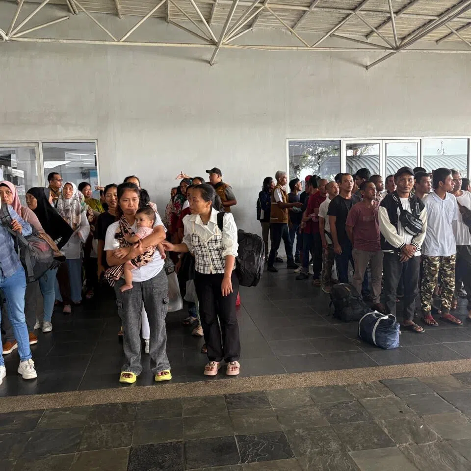 A group of repatriated Indonesians waiting for the next leg of their journey after arriving at Batam Centre International Ferry Port from Johor Bahru in August.