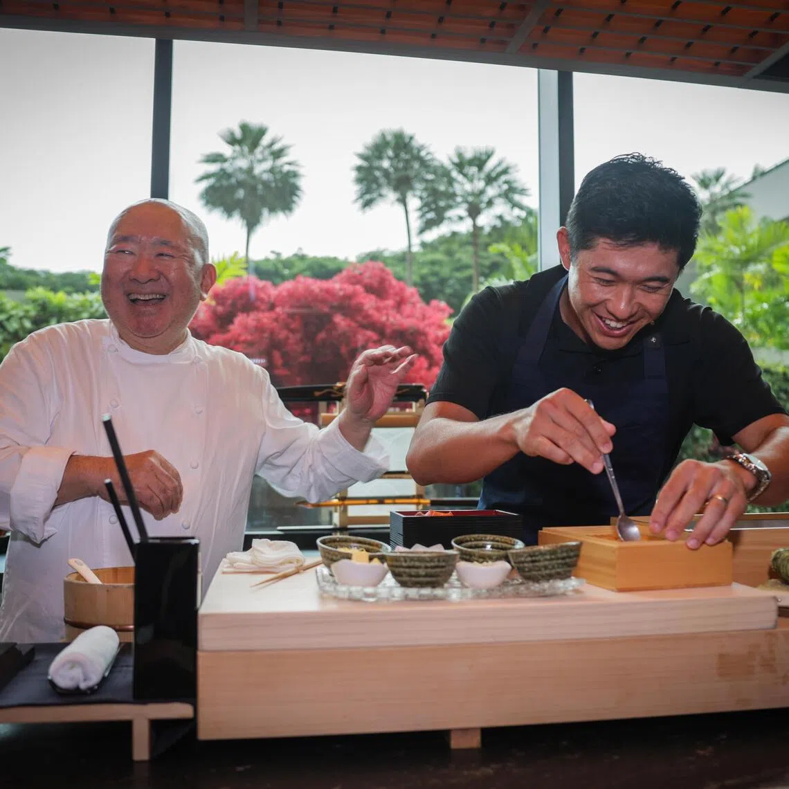 Renowned chef Tetsuya Wakuda (left) and PGA Tour player Collin Morikawa during a culinary contest at Wakuda Singapore restaurant on Oct 17.