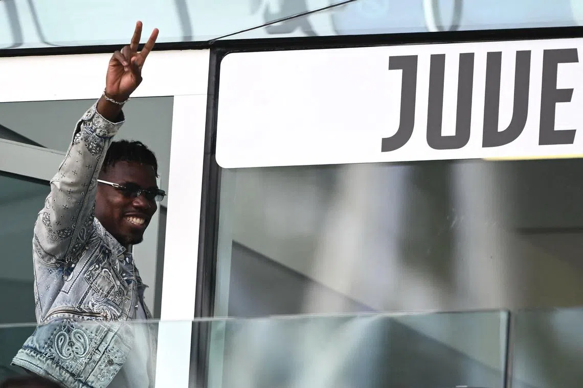 French forward Paul Pogba waves as he arrives to attend the Italian Serie A football match between Juventus and Cagliari at the Allianz stadium in Turin, on Oct 6, 2024. 