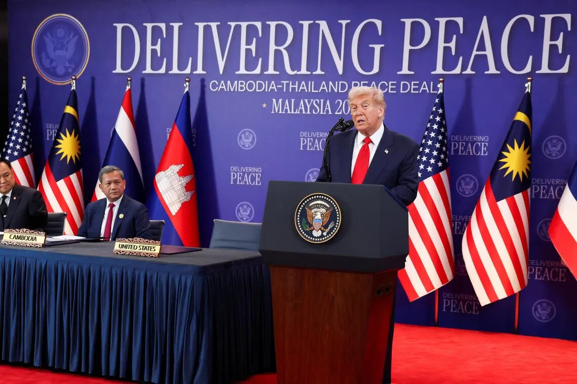 (From left) Thai Prime Minister Anutin Charnvirakul and Cambodian Prime Minister Hun Manet look on as US President Donald Trump speaks ahead of the signing of a ceasefire deal in Kuala Lumpur on Oct 26.