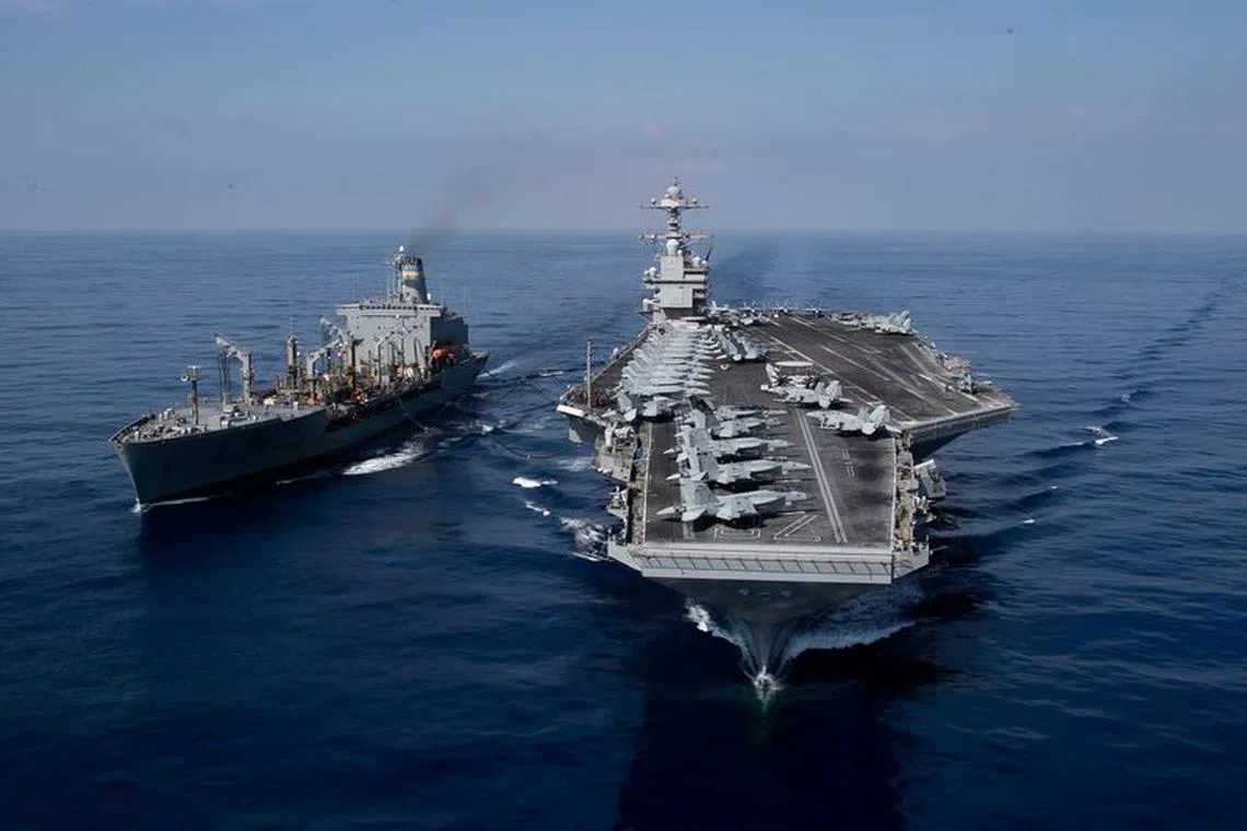 The world’s largest aircraft carrier USS Gerald R. Ford steams alongside USNS Laramie (T-AO-203) during a fueling-at-sea in the eastern Mediterranean Sea, as a scheduled deployment in the U.S Naval Forces Europe area of operations, deployed by U.S. Sixth Fleet to defend U.S, allied, and partners interests, in this photo taken on October, 11, 2023 and released by U.S. Navy on October 14, 2023. U.S Naval Forces Central Command / U.S. 6th Fleet / Handout via REUTERS
