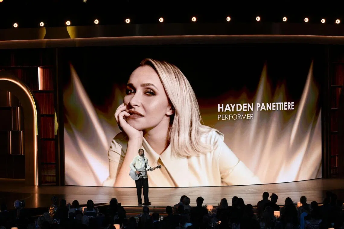 A picture of late US actress Hayden Panettiere is projected on screen as US singer/songwriter Noah Kahan performs during the 78th Primetime Emmy Awards at the Peacock Theatre at LA Live in Los Angeles on September 14, 2026. (Photo by Patrick T. Fallon / AFP) / RESTRICTED TO EDITORIAL USE