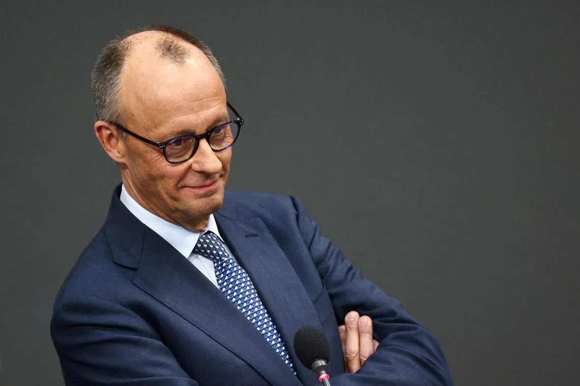 German Chancellor Friedrich Merz reacts as he answers questions from lawmakers during a plenum session of the lower house of parliament, the Bundestag, in Berlin, Germany March 25, 2026.  REUTERS/Liesa Johannssen