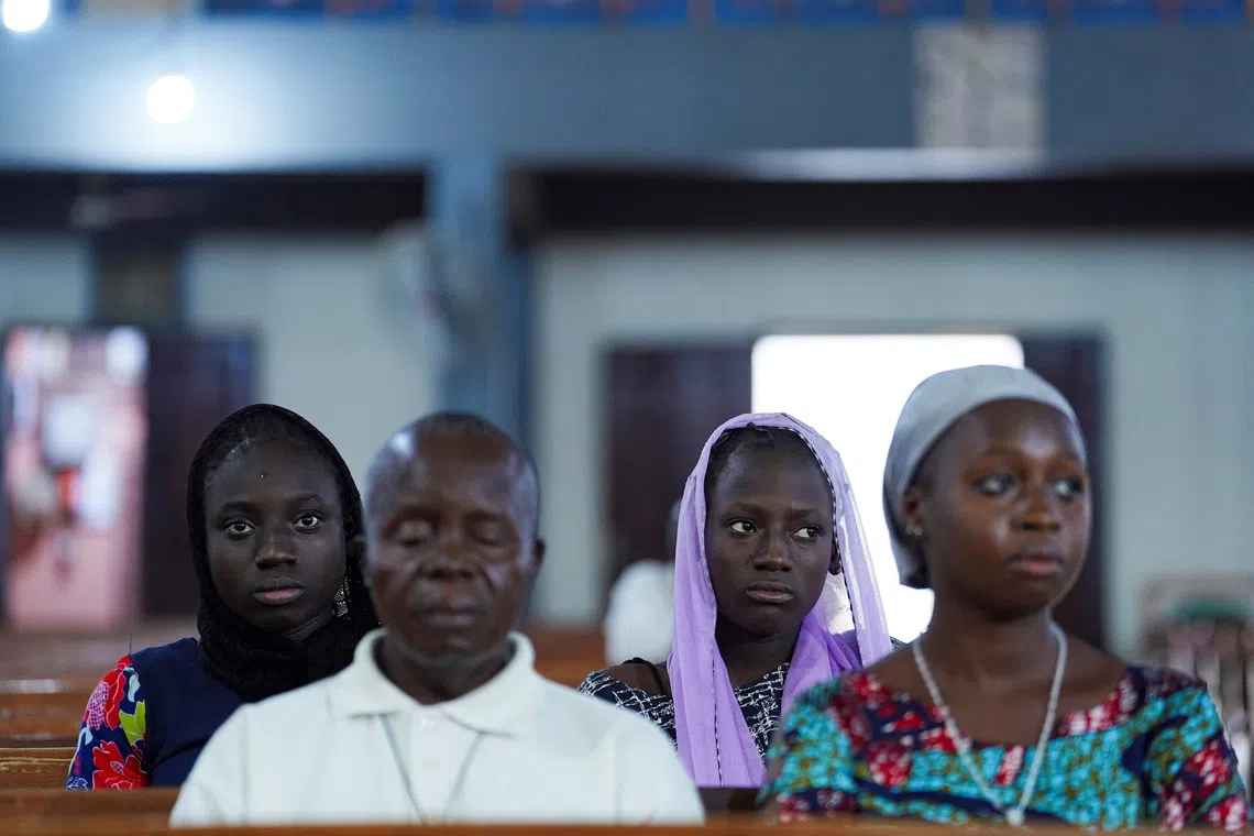 Worshippers attend an evening mass at St. Michael Cathedral on Bosso Road in Minna, Niger State, Nigeria, December 4, 2025. REUTERS/Marvellous Durowaiye