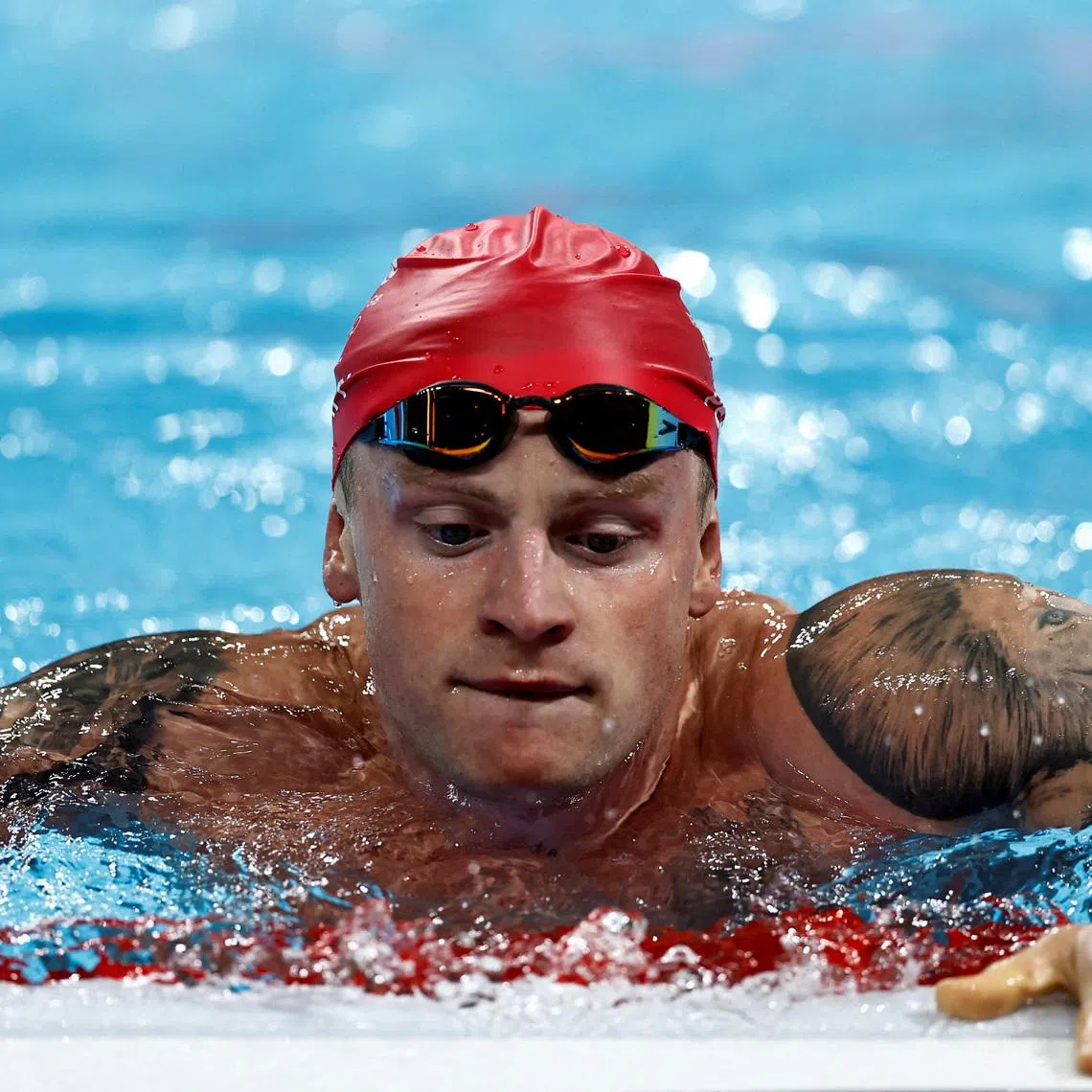 FILE PHOTO: Paris 2024 Olympics - Swimming - Men's 4 x 100m Medley Relay Final - Paris La Defense Arena, Nanterre, France - August 04, 2024. Adam Peaty of Britain reacts after the race. REUTERS/Clodagh Kilcoyne/File Photo