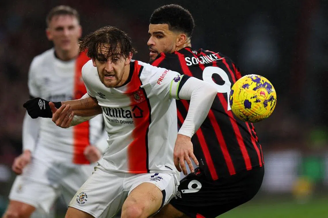 Soccer Football - Premier League - AFC Bournemouth v Luton Town - Vitality Stadium, Bournemouth, Britain - December 16, 2023 Luton Town's Tom Lockyer in action with AFC Bournemouth's Dominic Solanke REUTERS/Toby Melville/File Photo