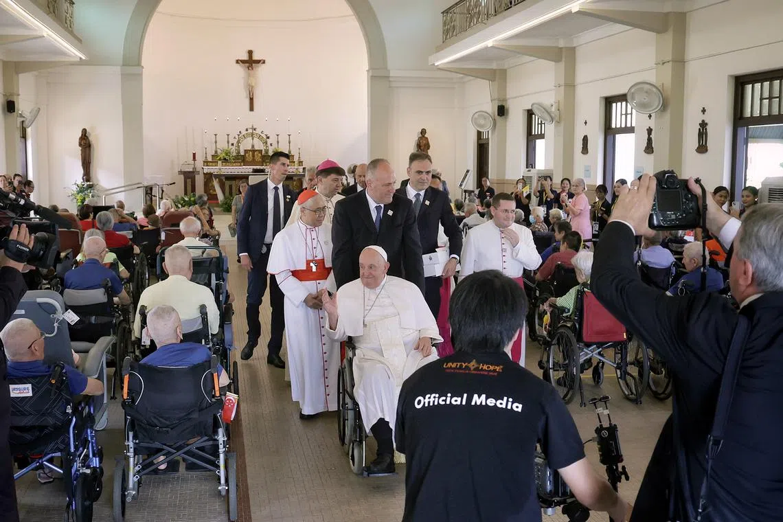 Pope Francis taking his leave after meeting and blessing elderly and sick residents at St Theresa's Home on Sept 13, 2024. ST PHOTO: KEVIN LIM pixpope13