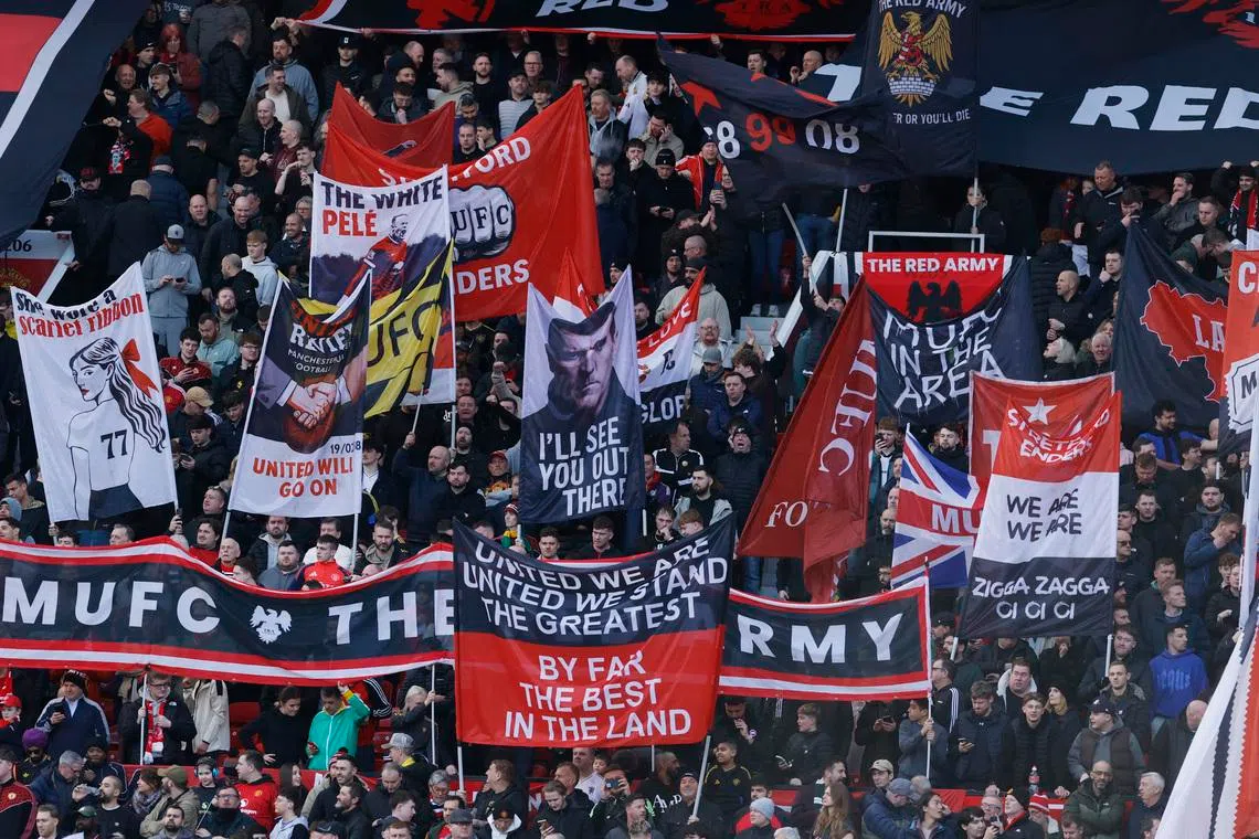 Soccer Football - Premier League - Manchester United v Crystal Palace - Old Trafford, Manchester, Britain - March 1, 2026 Manchester United fans with banners inside the stadium before the match. Action Images via Reuters/Jason Cairnduff
