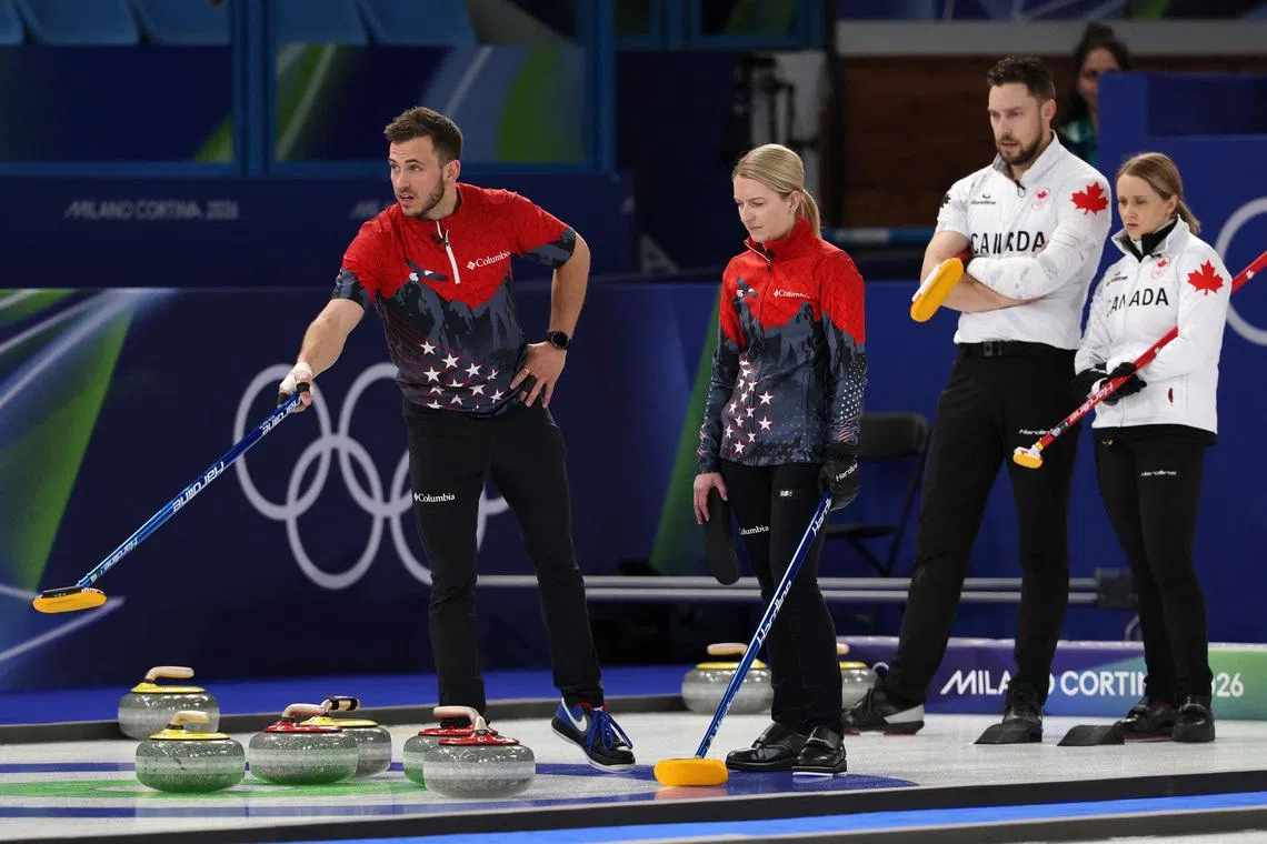 Milano Cortina 2026 Olympics - Curling - Mixed Doubles Round Robin Session 5 - United States of America vs Canada - Cortina Curling Olympic Stadium, Cortina d'Ampezzo, Italy - February 06, 2026. Korey Dropkin of United States and Cory Thiesse of United States look on during their match against Brett Gallant of Canada and Jocelyn Peterman of Canada REUTERS/Issei Kato