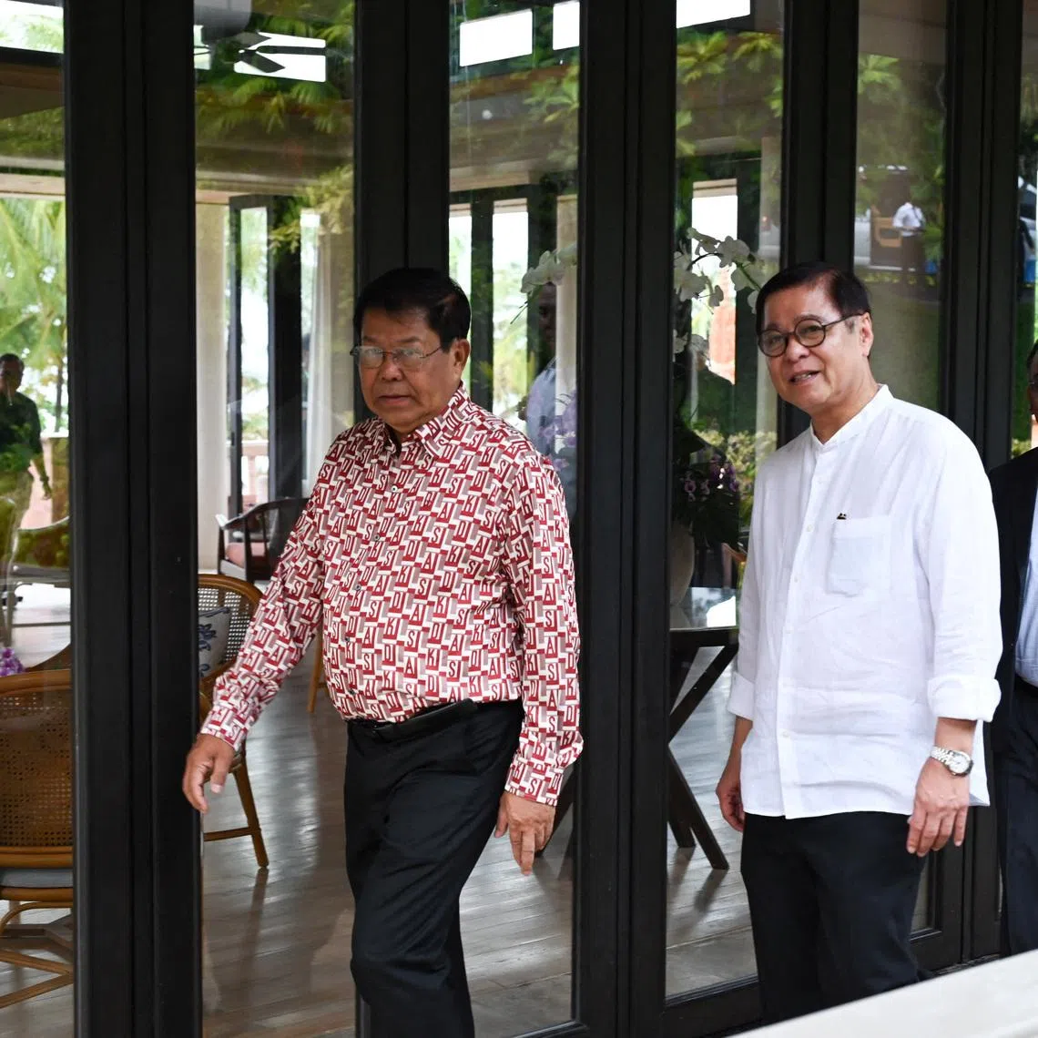 Thailand's Foreign Minister Sihasak Phuangketkeow and Myanmar's Foreign Minister Than Swe arrive ahead of bilateral talks, to discuss the way forward in Thailand-Myanmar relations and Myanmar relations with ASEAN following Myanmar’s general election earlier this year, in Phuket, Thailand, February 18, 2026. Ministry of Foreign Affairs/Handout via REUTERS