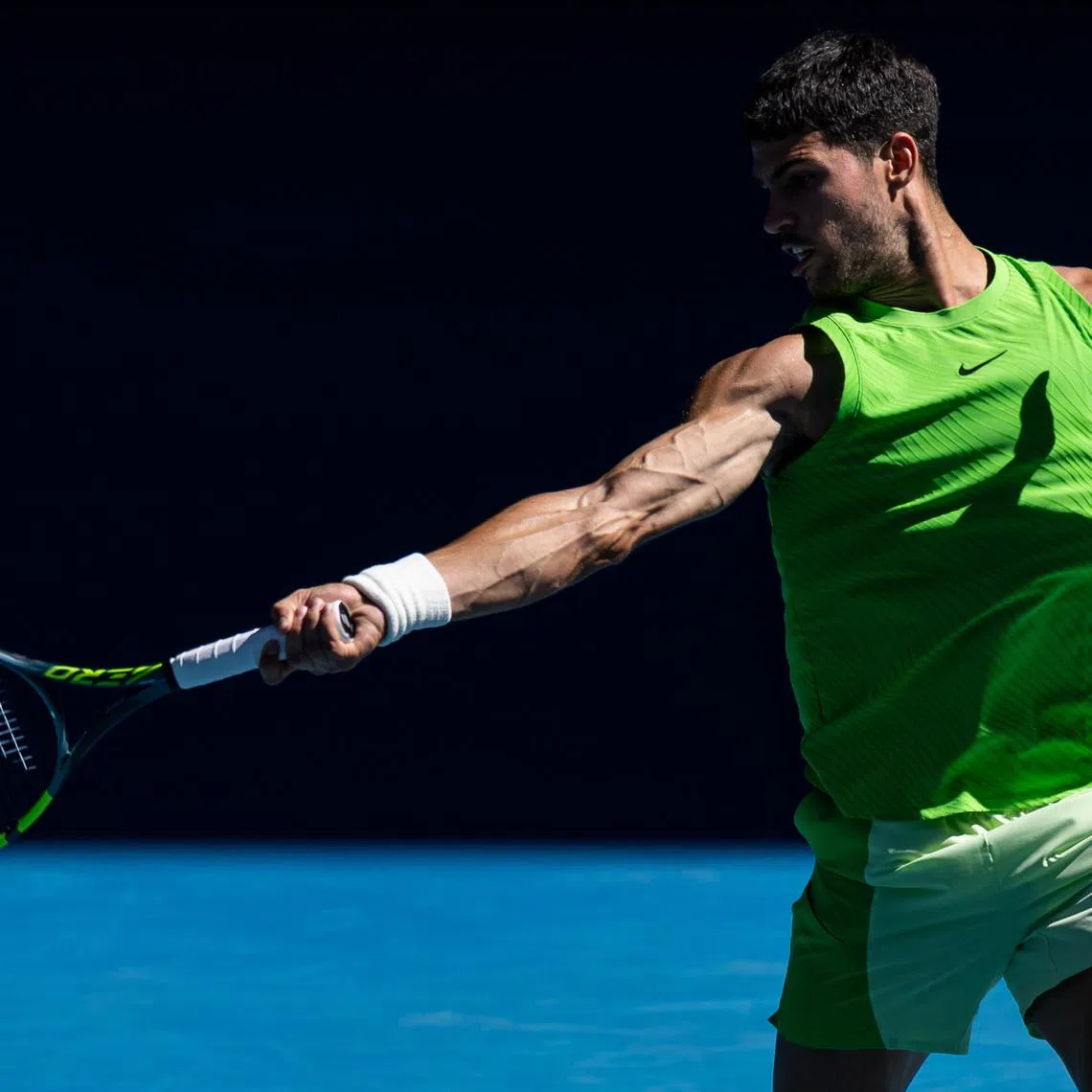 Jan 23, 2026; Melbourne, Victoria, Australia; Carlos Alcaraz of Spain in action against Corentin Moutet of France in the third round of the men’s singles at the Australian Open at Rod Laver Arena in Melbourne Park. Mandatory Credit: Mike Frey-Imagn Images
