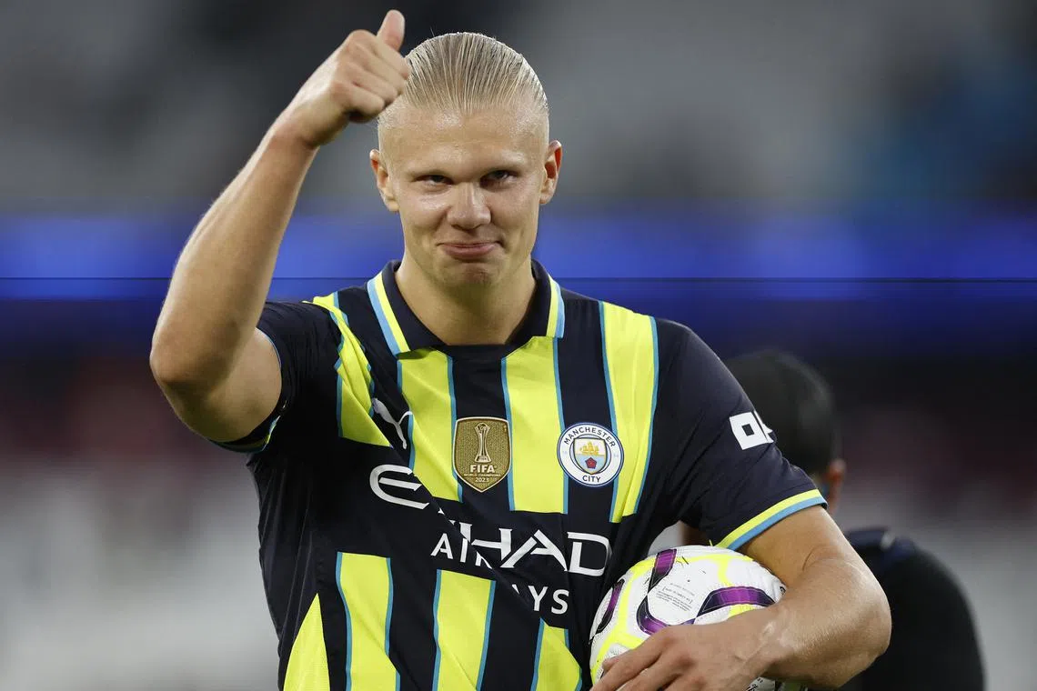 Soccer Football - Premier League - West Ham United v Manchester City - London Stadium, London, Britain - August 31, 2024 Manchester City's Erling Haaland applauds fans after the match as he holds the ball after scoring a hat-trick Action Images via Reuters/John Sibley