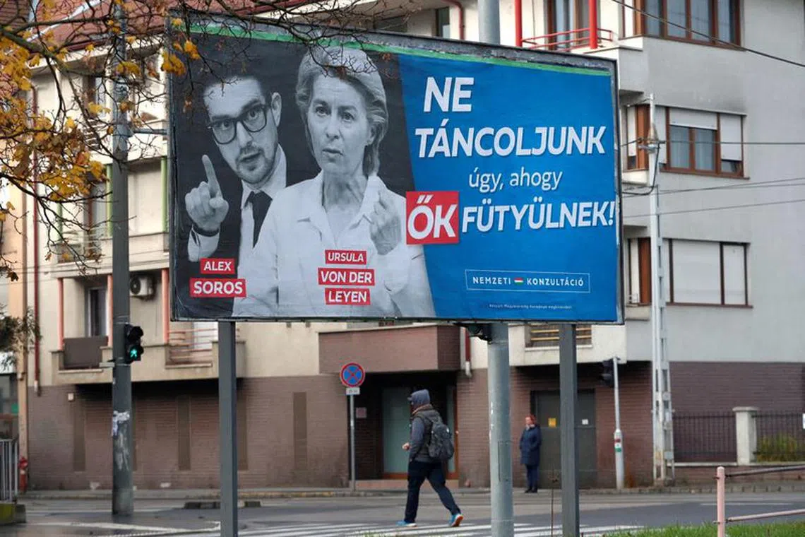 FILE PHOTO: A government billboard shows American philanthropist Alex Soros, son of Hungarian-American financier George Soros and European Commission President Ursula von der Leyen in Budapest, Hungary, November 20, 2023. The billboard reads, \"Let's not dance to their tunes\". REUTERS/Bernadett Szabo/File Photo