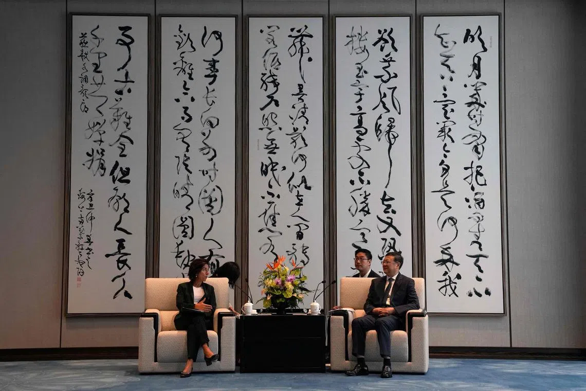 US Commerce Secretary Gina Raimondo (L) talking with Shanghai Party Secretary Chen Jining during a meeting in Shanghai on August 30, 2023. 