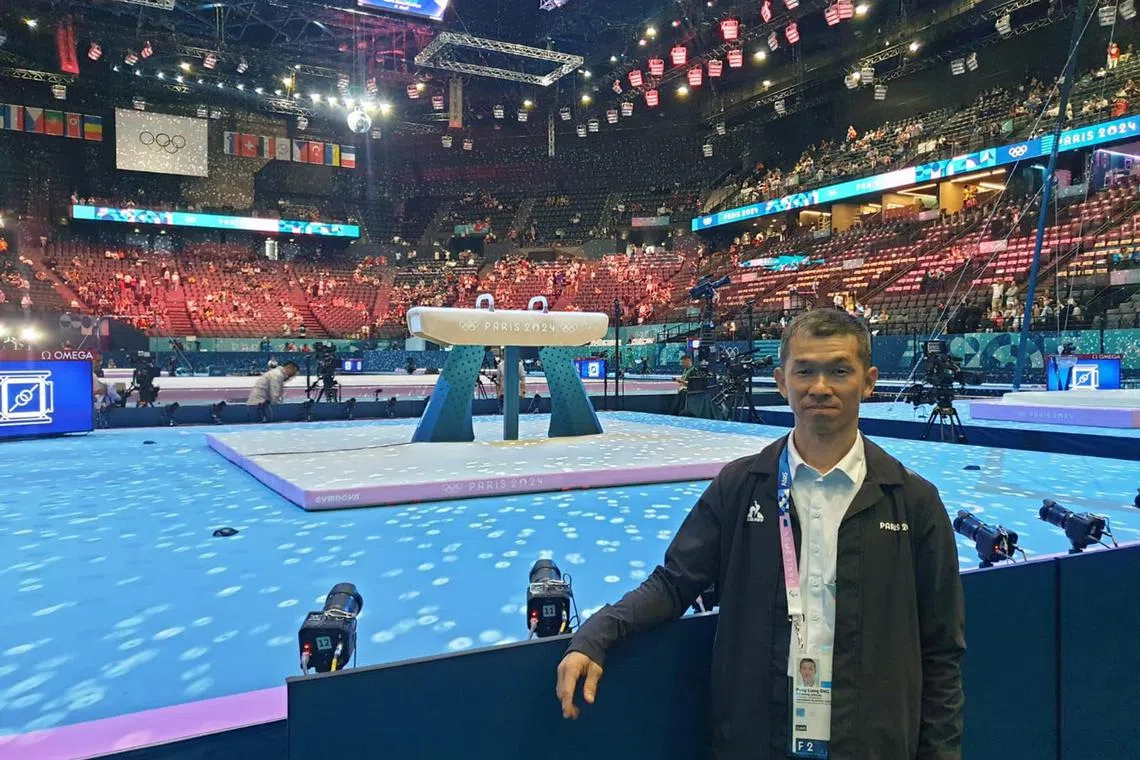dlofficials - Singaporean gymnastics judge Sng Puay Liang at the Bercy Arena in France. Sng, 54, was appointed a judge at the Paris Olympics, making him the first Singaporean judge at the quadrennial event. Credit: Courtesy of Sng Puay Liang