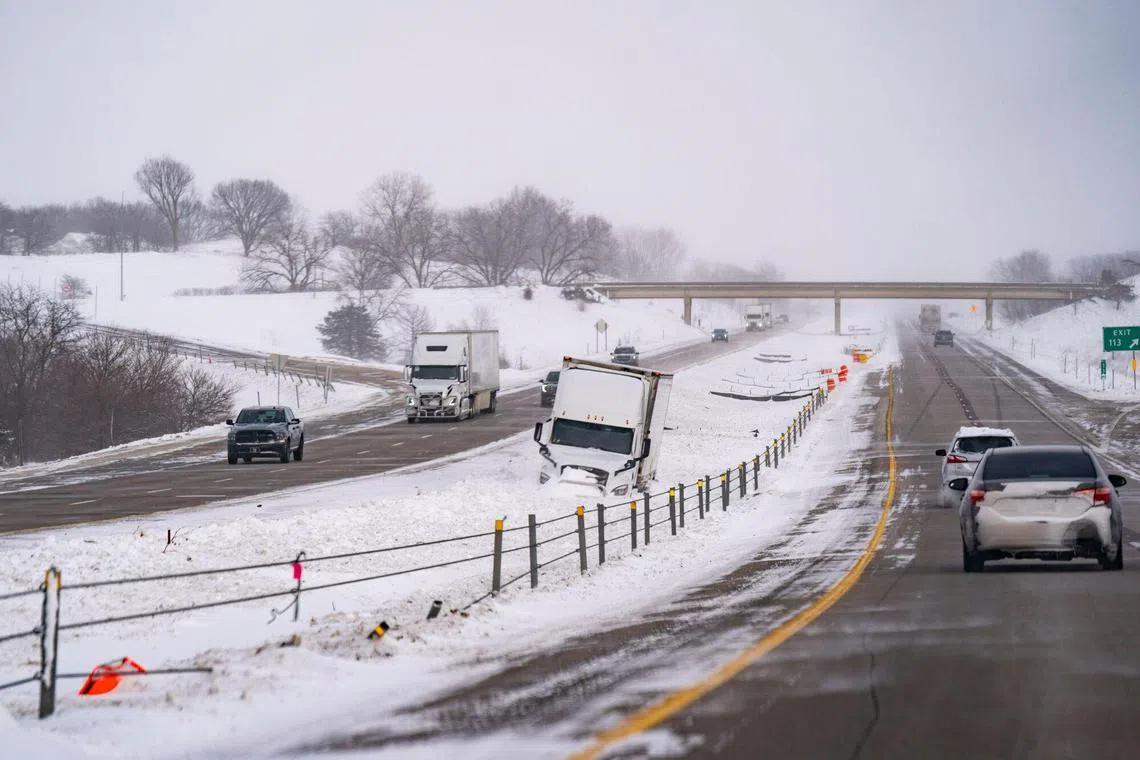 A stuck tractor trailer on Interstate 80 ahead of the Iowa Caucus in Atlantic, Iowa, US, on Jan 13. 