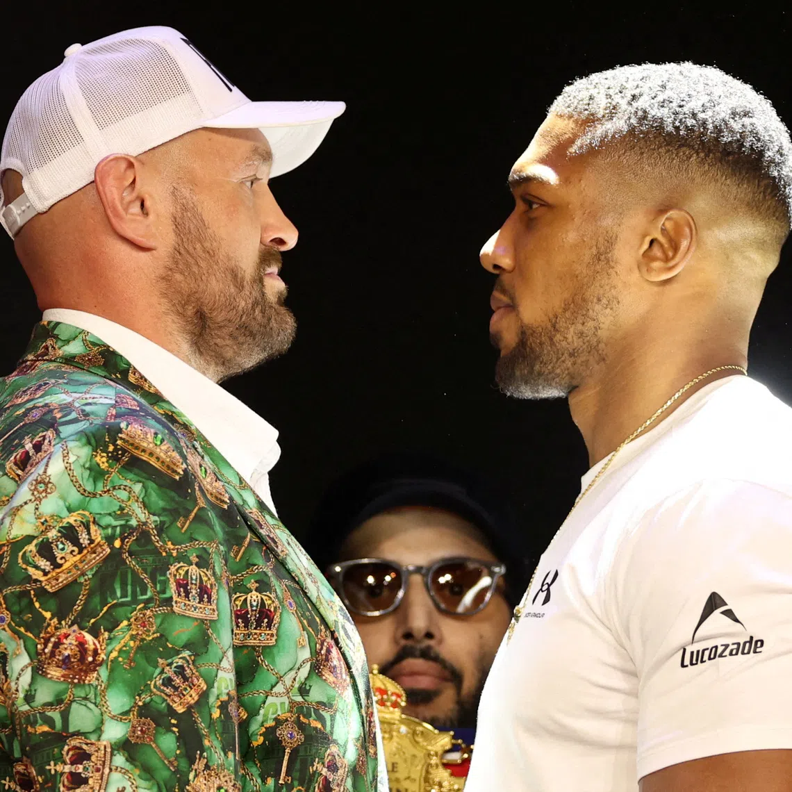 Boxing - Anthony Joshua & Tyson Fury Press Conference - British Airways ARC, London, Britain - September 30, 2026 Anthony Joshua and Tyson Fury face off as the Chairman of Saudi Arabia's General Entertainment Authority, Turki Al-Sheikh looks on during the press conference Action Images via Reuters/John Sibley