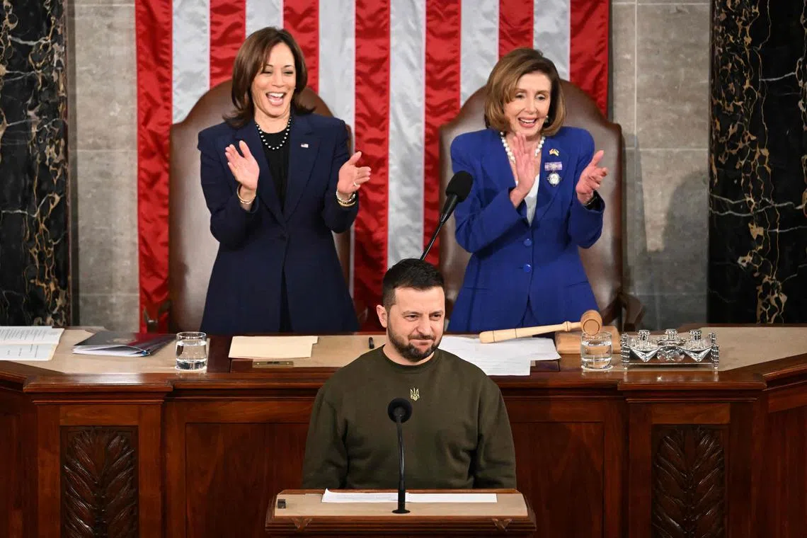 Ukraine President Volodymyr Zelensky addressing the US Congress as US Vice-President Kamala Harris and US House Speaker Nancy Pelosi applaud.