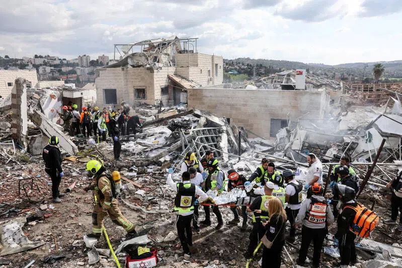 Emergency response teams attend the scene of a fatal Iranian strike in Beth Shemesh, Israel on March 1, 2026.