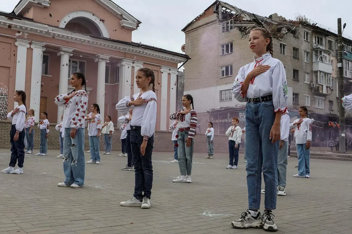 Children take part in a celebration of the first anniversary of the recapturing of their town, amid Russia's attack on Ukraine, in Izium in Kharkiv region, Ukraine, on Sept 10.