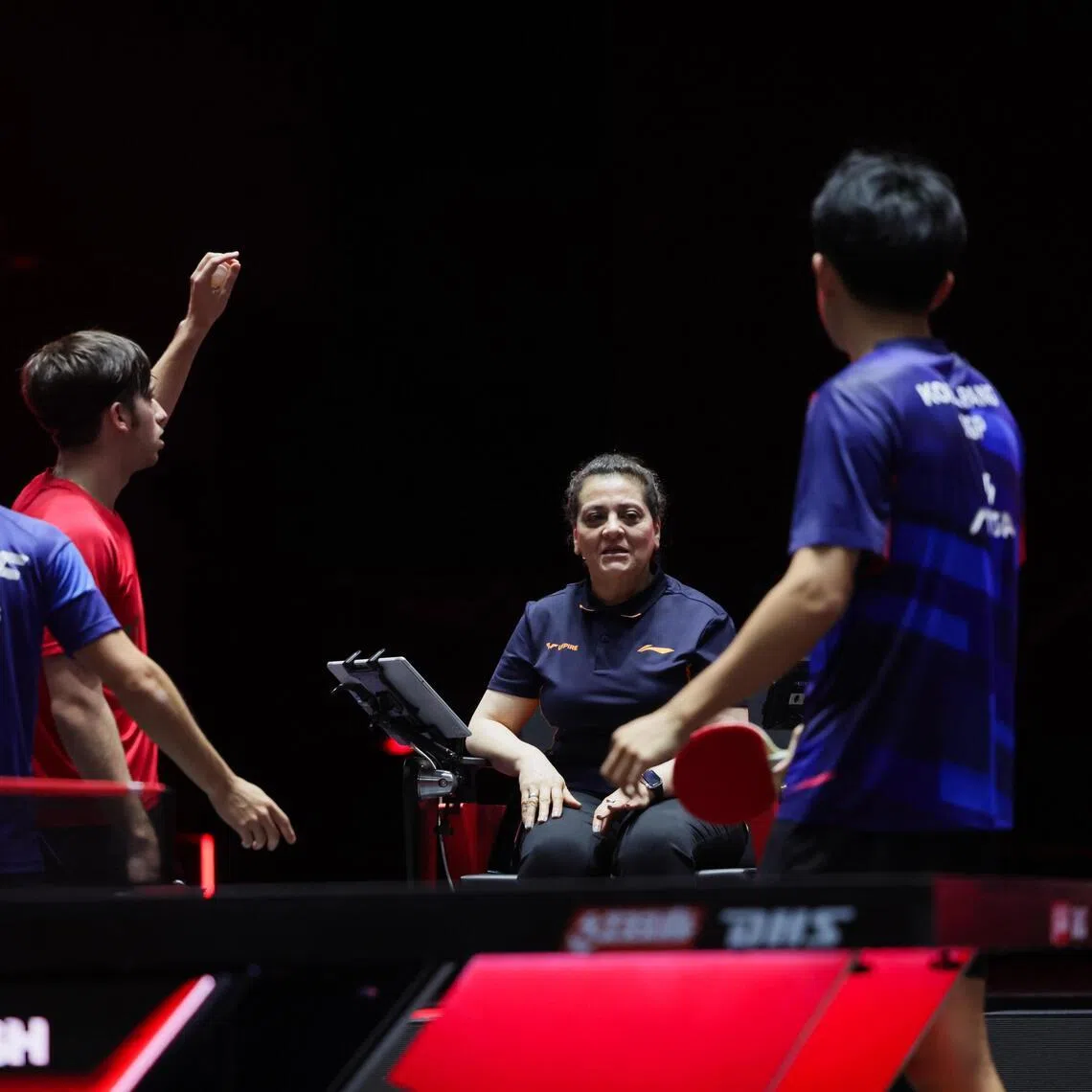 Singapore's Koen Pang and Izaac Quek (right) speak with the umpire after their Argentine rivals were penalised a point during their match. 