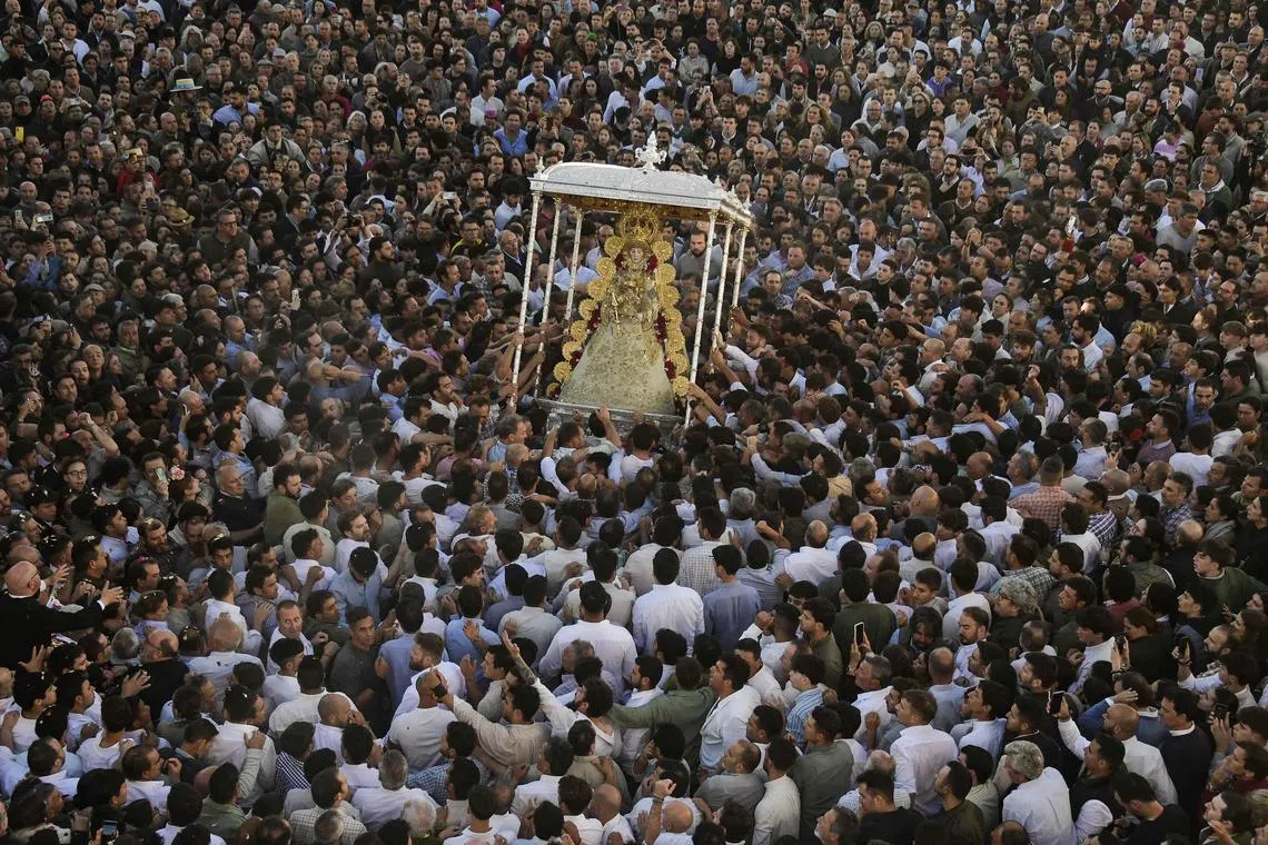 Pilgrims gathering around the effigy of the Rocio Virgin during the annual pilgrimage in El Rocio village, Spain, on May 20, 2024. 
