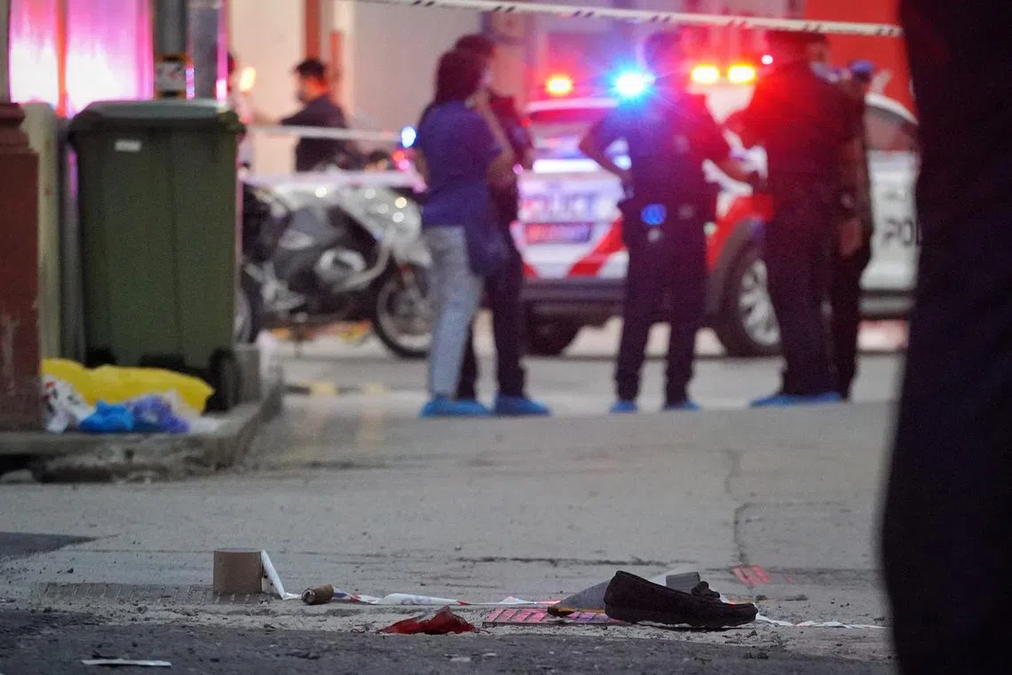 Investigators near the scene of the Beach Road slashing on Apr 14, 2022.
