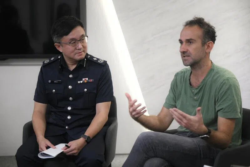 Online Criminal Harms Act Office director Marc E (left) and Mr Gijs Verheijke, Carousell's director of trust and customer experience, speaking to the press on Feb 19.