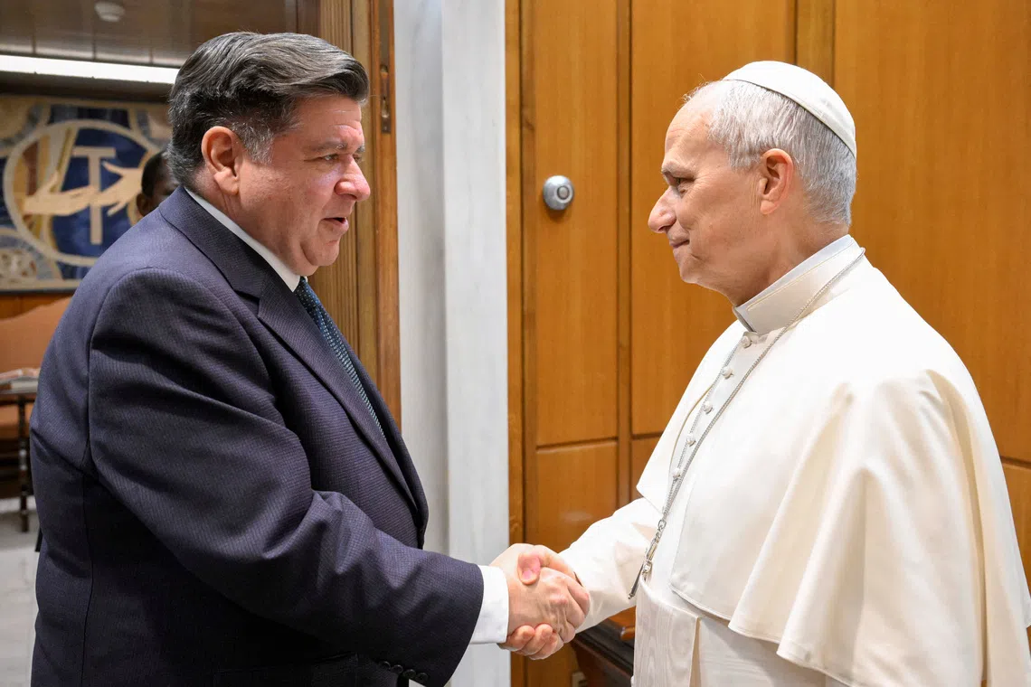 Illinois Governor JB Pritzker shakes hands with Pope Leo XIV at the Vatican, November 19, 2025.  Simone Risoluti/Vatican Media/­Handout via REUTERS    ATTENTION EDITORS - THIS IMAGE WAS PROVIDED BY A THIRD PARTY.