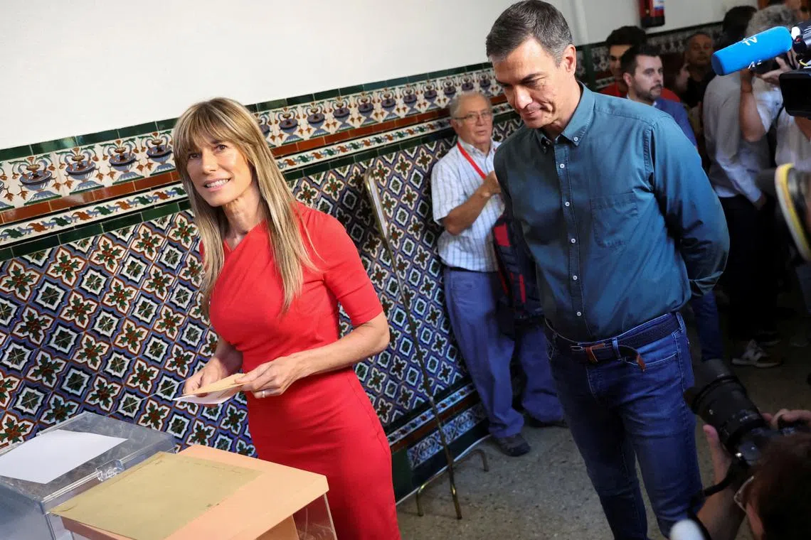 FILE PHOTO: Spain's Prime Minister Pedro Sanchez looks on as his wife Begona Gomez votes during the general snap election in Madrid, Spain, July 23, 2023. REUTERS/Nacho Doce/File Photo