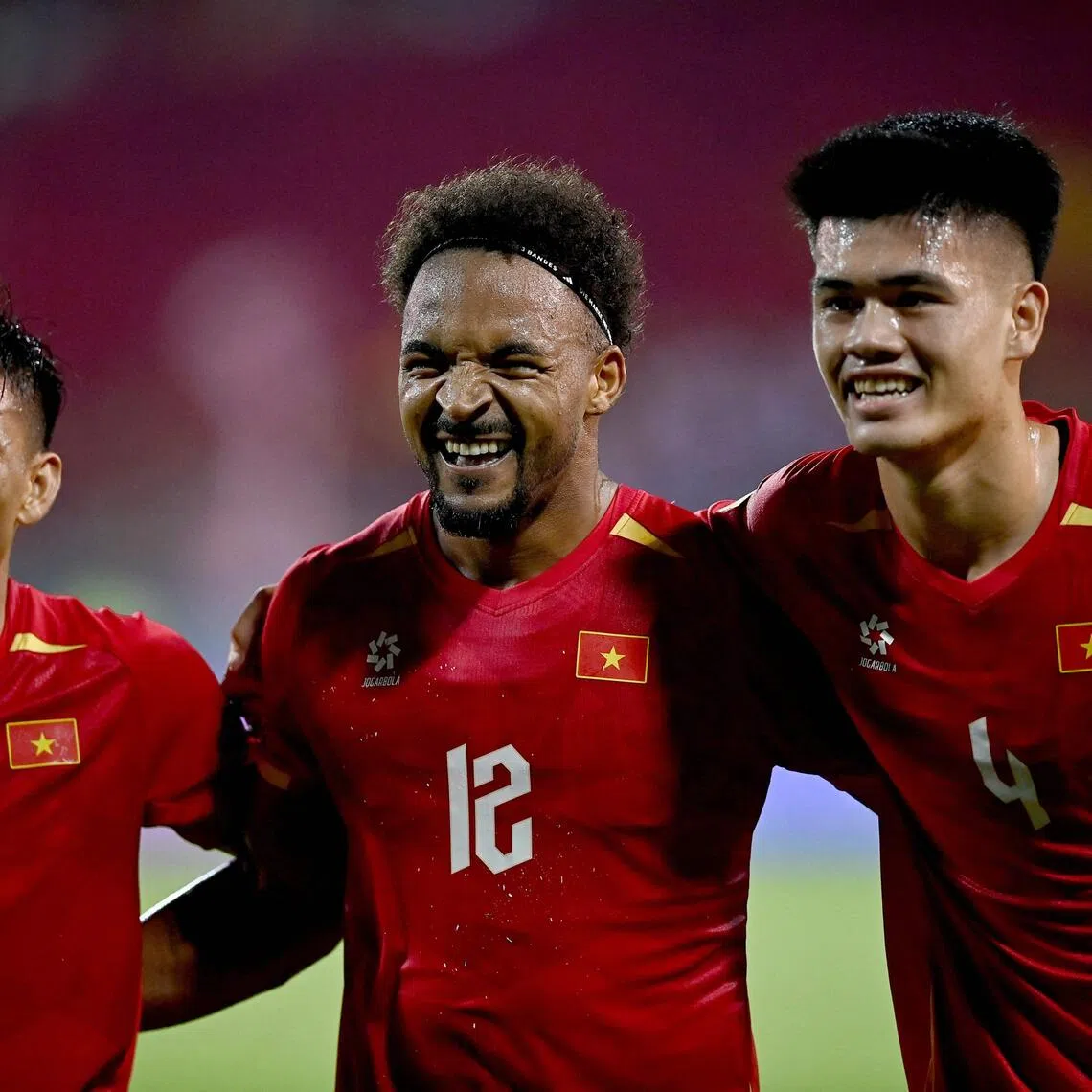 Vietnam’s Nguyen Xuan Son (centre) celebrating with teammates on Aug 19.