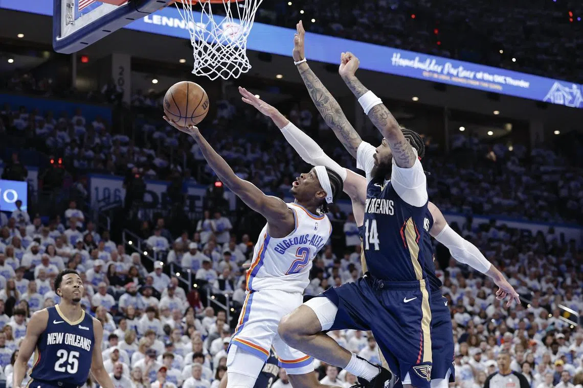 Oklahoma City Thunder guard Shai Gilgeous-Alexander driving to the basket in front of New Orleans Pelicans forward Brandon Ingram during the fourth quarter of the Thunder's 94-92 victory in their National Basketball Association play-off opener on April 21.