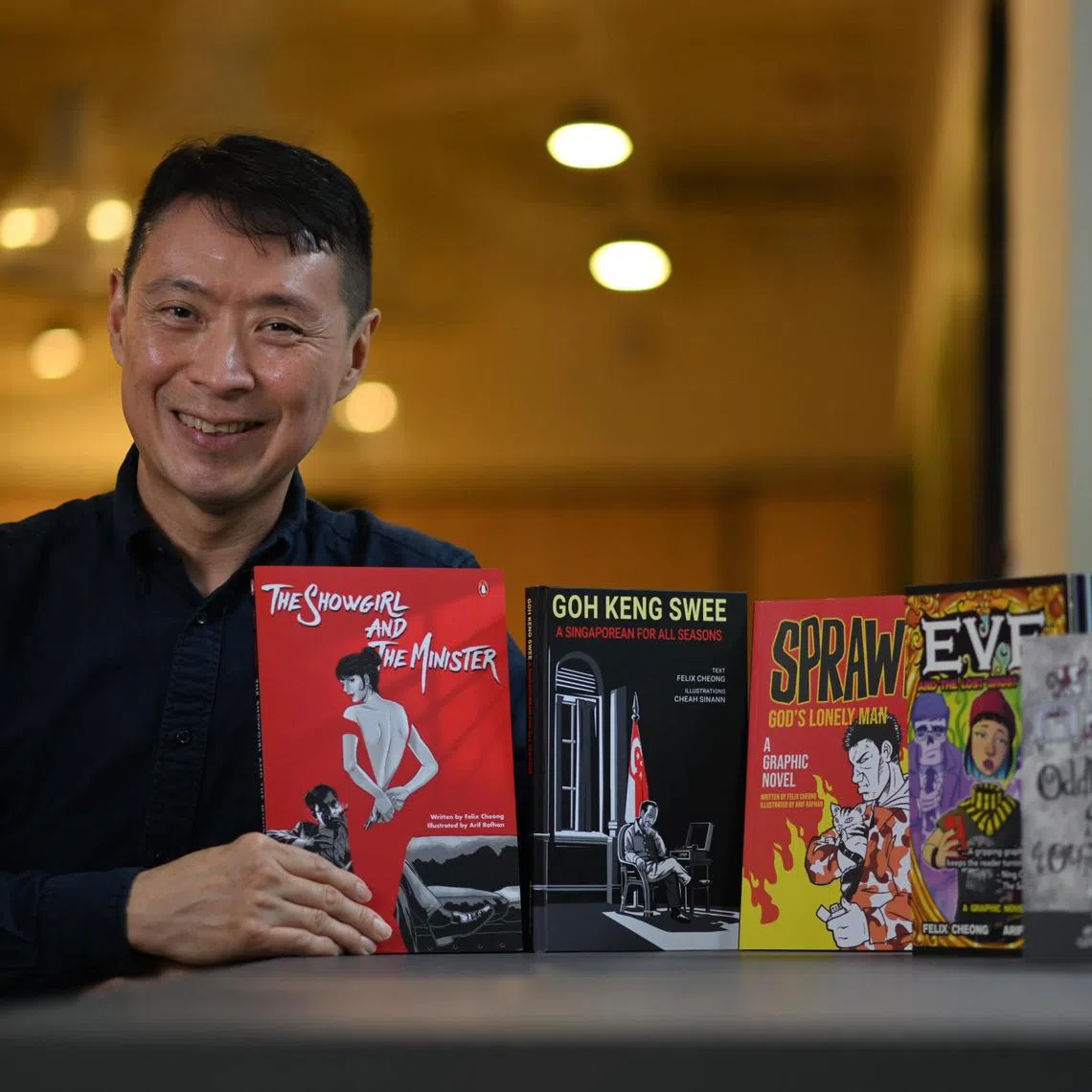Portrait of Singaporean author Felix Cheong, with his books taken on December 6, 2023. 


*****

Photograph of Singaporean author Felix Cheong, who is releasing 7 books in a year.